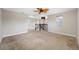 Large bonus room with carpeting, lots of light, and staircase access at 4943 Grand Oak Cir, Madeira Beach, FL 33708