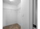 Walk-in closet with carpet flooring and wire shelving for ample storage at 4943 Grand Oak Cir, Madeira Beach, FL 33708
