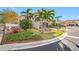 Two-story house with brown garage door and landscaping, viewed from the side at 4943 Grand Oak Cir, Madeira Beach, FL 33708