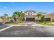 Two-story house with brown garage door and landscaping, viewed from across the street at 4943 Grand Oak Cir, Madeira Beach, FL 33708