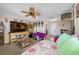 Relaxing game room with a large TV and seating at 4943 Grand Oak Cir, Madeira Beach, FL 33708