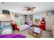 Game room with TV, jukebox, and comfy seating at 4943 Grand Oak Cir, Madeira Beach, FL 33708
