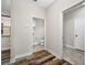 Hallway features unique wood flooring and access to bathroom and other rooms at 4943 Grand Oak Cir, Madeira Beach, FL 33708