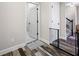 Bright hallway with wood flooring and access to other rooms at 4943 Grand Oak Cir, Madeira Beach, FL 33708