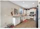 Well-equipped kitchen with granite countertops, white cabinets, and stainless steel appliances at 4943 Grand Oak Cir, Madeira Beach, FL 33708