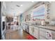 Bright kitchen with granite countertops and ample cabinet space at 4943 Grand Oak Cir, Madeira Beach, FL 33708