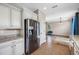 Well-appointed kitchen with stainless steel appliances, white cabinets, and spacious design at 4943 Grand Oak Cir, Madeira Beach, FL 33708