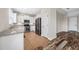 Spacious kitchen featuring stainless steel appliances and white cabinetry, with breakfast area at 4943 Grand Oak Cir, Madeira Beach, FL 33708