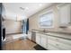 Bright kitchen features granite countertops, stainless steel appliances, and backyard access at 4943 Grand Oak Cir, Madeira Beach, FL 33708