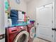 Laundry room with Samsung washer and dryer, and ample storage at 4943 Grand Oak Cir, Madeira Beach, FL 33708