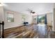 Bright living room with hardwood floors, ample natural light, and backyard access at 4943 Grand Oak Cir, Madeira Beach, FL 33708