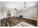 Open-concept living room featuring hardwood floors and a cozy entryway at 4943 Grand Oak Cir, Madeira Beach, FL 33708
