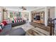 Spacious living room features a sectional sofa, hardwood floors, and built-in shelving at 4943 Grand Oak Cir, Madeira Beach, FL 33708