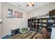 Home office with hardwood floors and storage at 4943 Grand Oak Cir, Madeira Beach, FL 33708