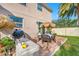 Relaxing patio area with table, chairs, and string lights at 4943 Grand Oak Cir, Madeira Beach, FL 33708