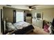 Comfortable main bedroom with a queen-size bed and plenty of storage at 7749 Broad Point Dr, Zephyrhills, FL 33540