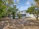 Landscaped backyard with screened pool at 8304 Sandstone Ct, Tampa, FL 33615