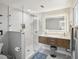 Modern bathroom with a large walk-in shower and double vanity at 8304 Sandstone Ct, Tampa, FL 33615