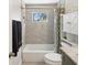Updated bathroom with a tub, shower, and stylish vanity at 8304 Sandstone Ct, Tampa, FL 33615