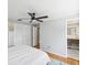 Bright bedroom with hardwood floors and a ceiling fan at 8304 Sandstone Ct, Tampa, FL 33615