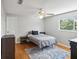 Bedroom with hardwood floors and a gray colored bedspread at 8304 Sandstone Ct, Tampa, FL 33615