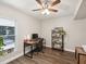 Bright home office with built-in shelving and large window at 8304 Sandstone Ct, Tampa, FL 33615