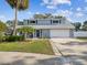 Two-story house with gray exterior and landscaping at 8304 Sandstone Ct, Tampa, FL 33615