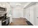 Open concept kitchen with white cabinets and stainless steel appliances at 8304 Sandstone Ct, Tampa, FL 33615