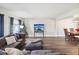 Spacious living room featuring hardwood floors and comfortable seating at 8304 Sandstone Ct, Tampa, FL 33615