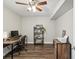 Home office features a desk, chair, and shelving unit at 8304 Sandstone Ct, Tampa, FL 33615
