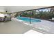 Screened pool and patio area with seating at 8304 Sandstone Ct, Tampa, FL 33615