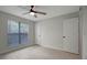 Well-lit bedroom with ceiling fan and window coverings at 10110 Winsford Oak Blvd # 612, Tampa, FL 33624