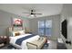 Spacious bedroom with ceiling fan and large window at 10110 Winsford Oak Blvd # 612, Tampa, FL 33624