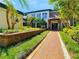 Building exterior with walkway and landscaping at 10110 Winsford Oak Blvd # 612, Tampa, FL 33624