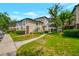 Building exterior with walkway and landscaping at 10110 Winsford Oak Blvd # 612, Tampa, FL 33624