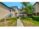 Exterior view of condo building with landscaping and walkway at 10110 Winsford Oak Blvd # 612, Tampa, FL 33624