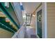 Condo hallway with green door and stairs at 10110 Winsford Oak Blvd # 612, Tampa, FL 33624