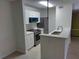 Modern kitchen with white cabinets and stainless steel appliances at 10110 Winsford Oak Blvd # 612, Tampa, FL 33624
