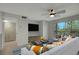 Living room with staged furniture and balcony view at 10110 Winsford Oak Blvd # 612, Tampa, FL 33624