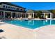 Resort-style pool with lounge chairs and clubhouse at 10110 Winsford Oak Blvd # 612, Tampa, FL 33624