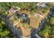 Home with a pool, viewed from above showcasing the property and surroundings at 1130 Barranca Ave, Spring Hill, FL 34609