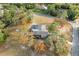 An aerial view of a home with a pool and spacious yard at 1130 Barranca Ave, Spring Hill, FL 34609