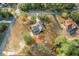 Aerial view of a home with a pool and surrounding landscape at 1130 Barranca Ave, Spring Hill, FL 34609