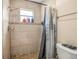 Clean bathroom with shower and tile surround at 1130 Barranca Ave, Spring Hill, FL 34609