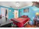 Bright bedroom with wood floors and a double bed at 1130 Barranca Ave, Spring Hill, FL 34609