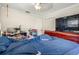 Primary bedroom with a large TV and double doors at 1130 Barranca Ave, Spring Hill, FL 34609