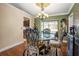 Bright dining room featuring a glass-top table and chandelier at 1130 Barranca Ave, Spring Hill, FL 34609