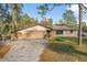 Single story home with attached garage and stone accents at 1130 Barranca Ave, Spring Hill, FL 34609
