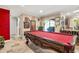 Game room with a pool table and access to the backyard at 1130 Barranca Ave, Spring Hill, FL 34609