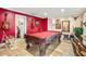 Game room boasts a classic pool table and Route 66 decor at 1130 Barranca Ave, Spring Hill, FL 34609